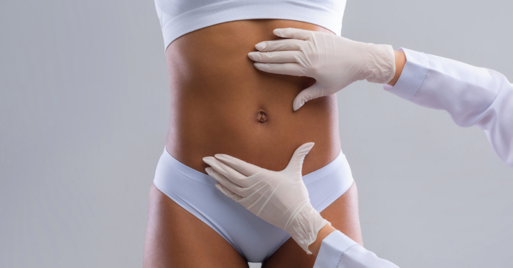 Doctor Performing Tummy Tuck Consultation